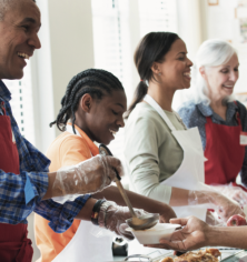 Man serving soup in serving line