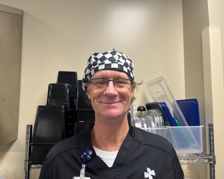 Porter smiling in his checkered hat