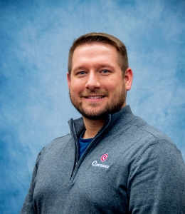 Mark Watje in a Curbtender branded 1/4 zip sweater