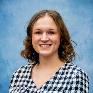 Andrea Randecker pictured in a black and white checked button-down shirt