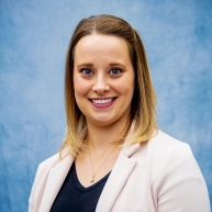 Karlie McPheeters in a blush blazer and navy top