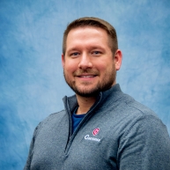 Mark Watje in a Curbtender branded 1/4 zip sweater